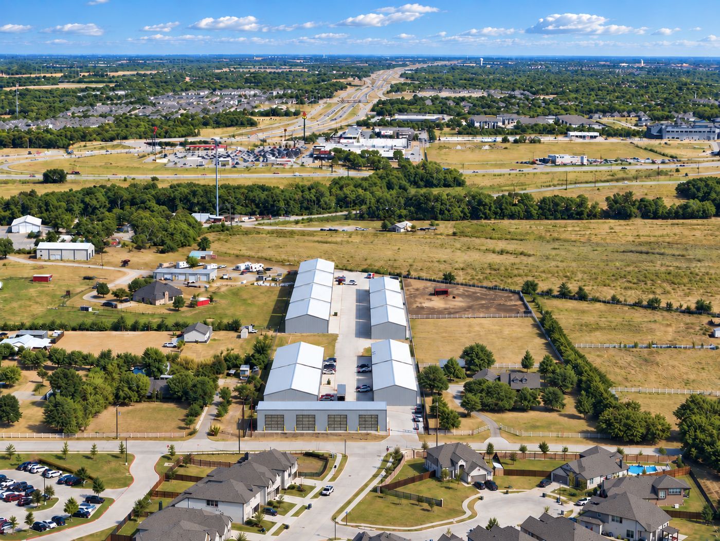 Aerial of the park with the SH-121 corridor behind it